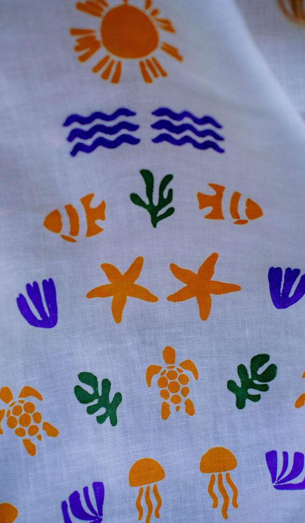 Resort wear and summer dresses in a Korčula concept store with flowing silhouettes